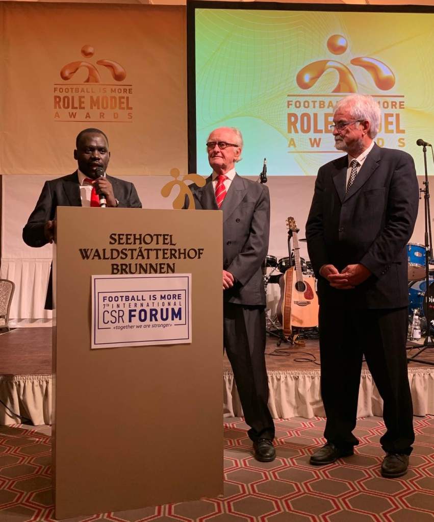 Hamilton Ayiera Nyanga, Heribert Scharrenbroich und Alois Kessler, Präsident von FiM (v.l.n.r.)